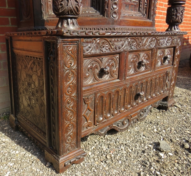 A large part 16th Century carved oak court cupboard with a central cupboard door flanked either - Image 5 of 11