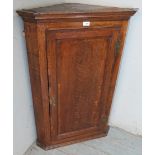 Georgian oak hanging corner cupboard with two internal shaped shelves Condition report: Few old