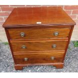 A 20th Century Georgian-revival small chest of three graduated drawers with brass ring handles and