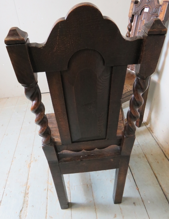 A pair of 17th Century oak hall chairs with carved motifs and spiral twist uprights and lower front - Image 7 of 8