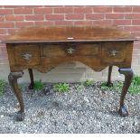 19th Century mahogany writing desk with three drawers over carved cabriole legs with ball and claw