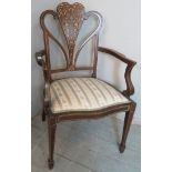 A pretty Edwardian marquetry inlaid open sided armchair with an upholstered seat over tapering legs.