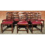 A set of eight early 20th Century mahogany framed dining chairs with red leather drop in seat pads.