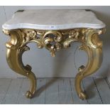 A 19th Century carved gilt wood console table with a white shaped marble top.