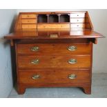 A George III pale mahogany bureau with a fall front flap opening to reveal a fitted interior over