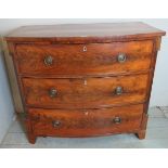 A George III flame mahogany bow front chest of three long drawers with ivory escutcheons and brass