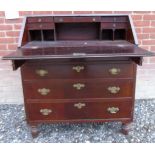 A 19th century mahogany bureau with a fall front revealing a fitted interior over four long