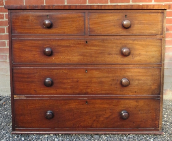 A 19th Century mahogany straight front chest of two short over three long graduated drawers with