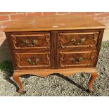 A 19th Century walnut chest of four drawers beneath a quarter veneered top with decorative moulding