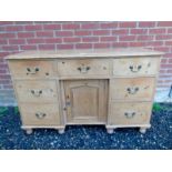 A Victorian pine break front dresser base with central drawer and cupboard,