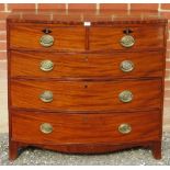 A 19th Century mahogany bow fronted chest of two short over three long drawers with brass handles