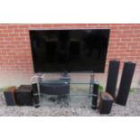 A 55" Samsung flat screen tv (model no: ue55es6800u) complete with a glass three tier tv stand and