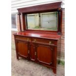 A large late 19th Century mahogany mirror backed sideboard with fluted upright supports over two