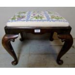 A 19th Century carved mahogany stool with a tapestry upholstered top.