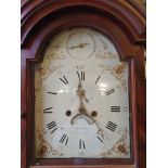 A Georgian mahogany cased eight day long case clock having a painted arched dial inscribed 'John