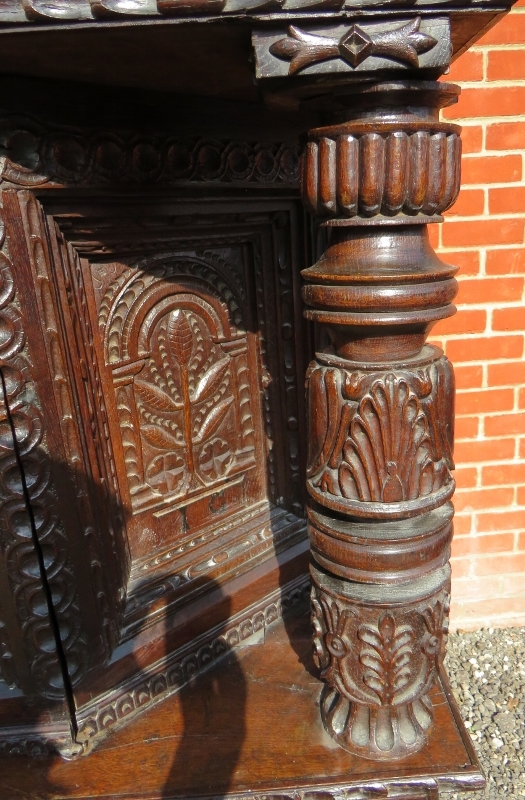 A large part 16th Century carved oak court cupboard with a central cupboard door flanked either - Image 8 of 11