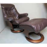 A contemporary leather stress less swivel recliner chair by 'Balance' complete with a matching