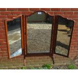 A small mahogany triple folding freestanding vanity mirror.