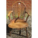 A 19th Century elm and beech wheel back chair.