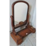 A 19th Century mahogany table top vanity mirror with a central lift up storage compartment over two