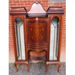 A large 19th Century inlaid mahogany display cabinet with a central serpentine fronted cupboard
