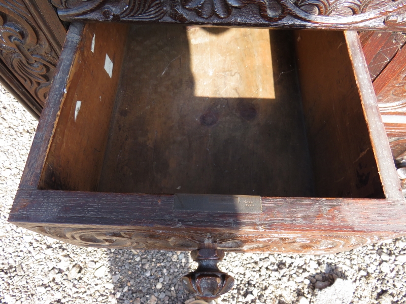 A large part 16th Century carved oak court cupboard with a central cupboard door flanked either - Image 6 of 11