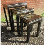 A 20th Century nest of three graduated lacquered oriental side tables depicting birds amongst