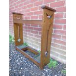 A 20th Century Art Nouveaux oak stick / umbrella stand complete with drip trays to base.