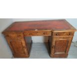 A pretty Victorian figured walnut reverse break front writing desk (all in one) with a tooled red