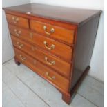 A Georgian oak chest of two short over three long graduated drawers with brass swan handles beneath