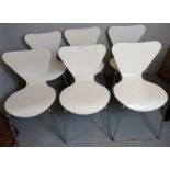 A set of six Arne Jacobsen for Fritz Hansen series 7 style dining chairs in cream with chrome legs,