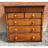 A Victorian mahogany Scotch chest of drawers ( later top) with turned handles.