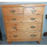 A late Victorian pine chest of two short over three long drawers,