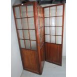 A 19th Century mahogany three section folding screen with twelve pane glazed sections to each panel