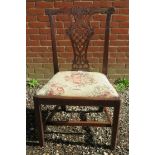 An 18th Century Chippendale design single chair with a carved back splat over an upholstered pad