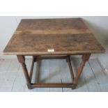 A late 18th / early 19th Century small oak side table with turned upright supports over lower