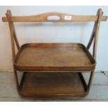 A small bentwood two tier serving tray with carry handle.