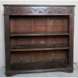 A 19th Century carved oak open bookcase with two adjustable shelves.