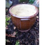 A small ceramic brown glazed garden planter / pot. Condition report: Some hairline cracks visible.