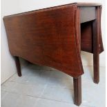 A Georgian mahogany serpentine drop leaf gate leg table table on moulded square legs.