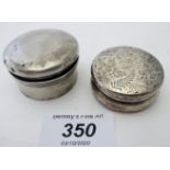 A silver circular pill box, engraved wit