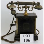 An early 1920's telephone on frame casin