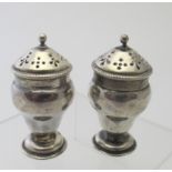 A pair of small Victorian silver vase sh