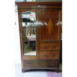 An Edwardian inlaid mahogany double wardrobe with a single glazed door to one side and having a