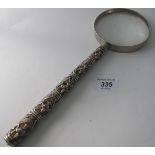 A large white metal magnifying glass. Th