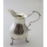 A silver cream jug in the Georgian style