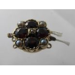 An early 20th century 9ct gold garnet an