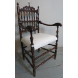 A pretty mahogany framed elbow chair wit