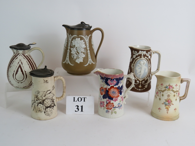 Six antique ceramic jugs including Crown