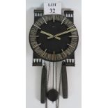 An Early 1970's Brutalist West German Atlanta wall clock with a three gong chime. Height: 33.5cm.